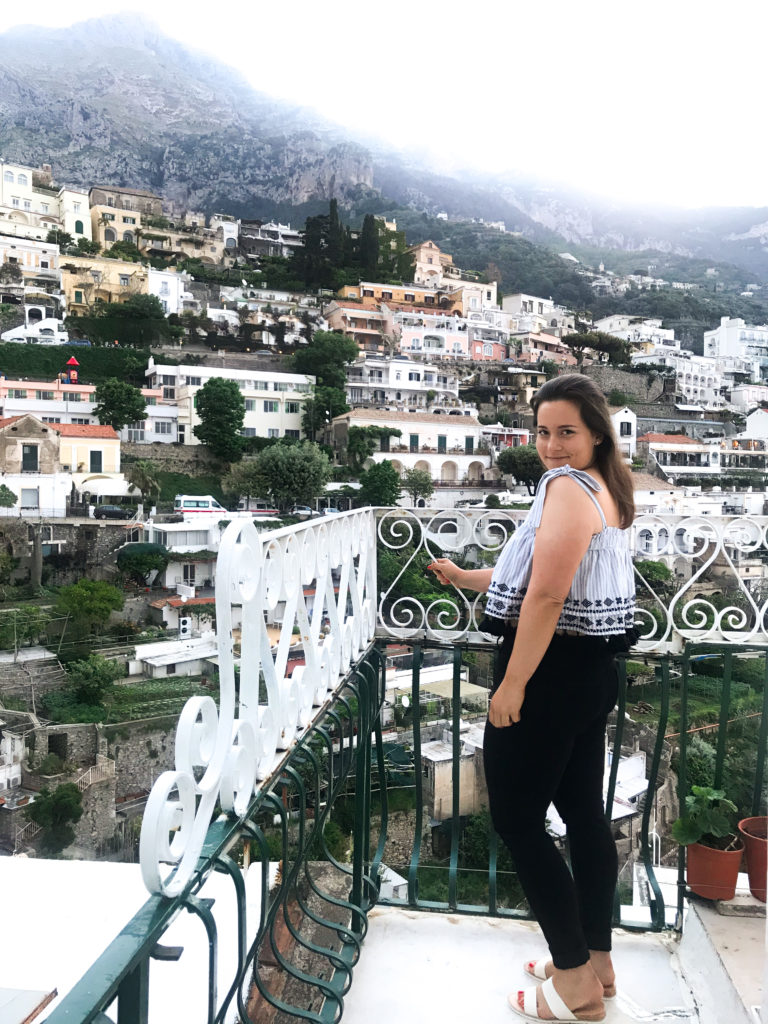 Travel blogger traveling alone in Positano, Amalfi Coast, Italy.